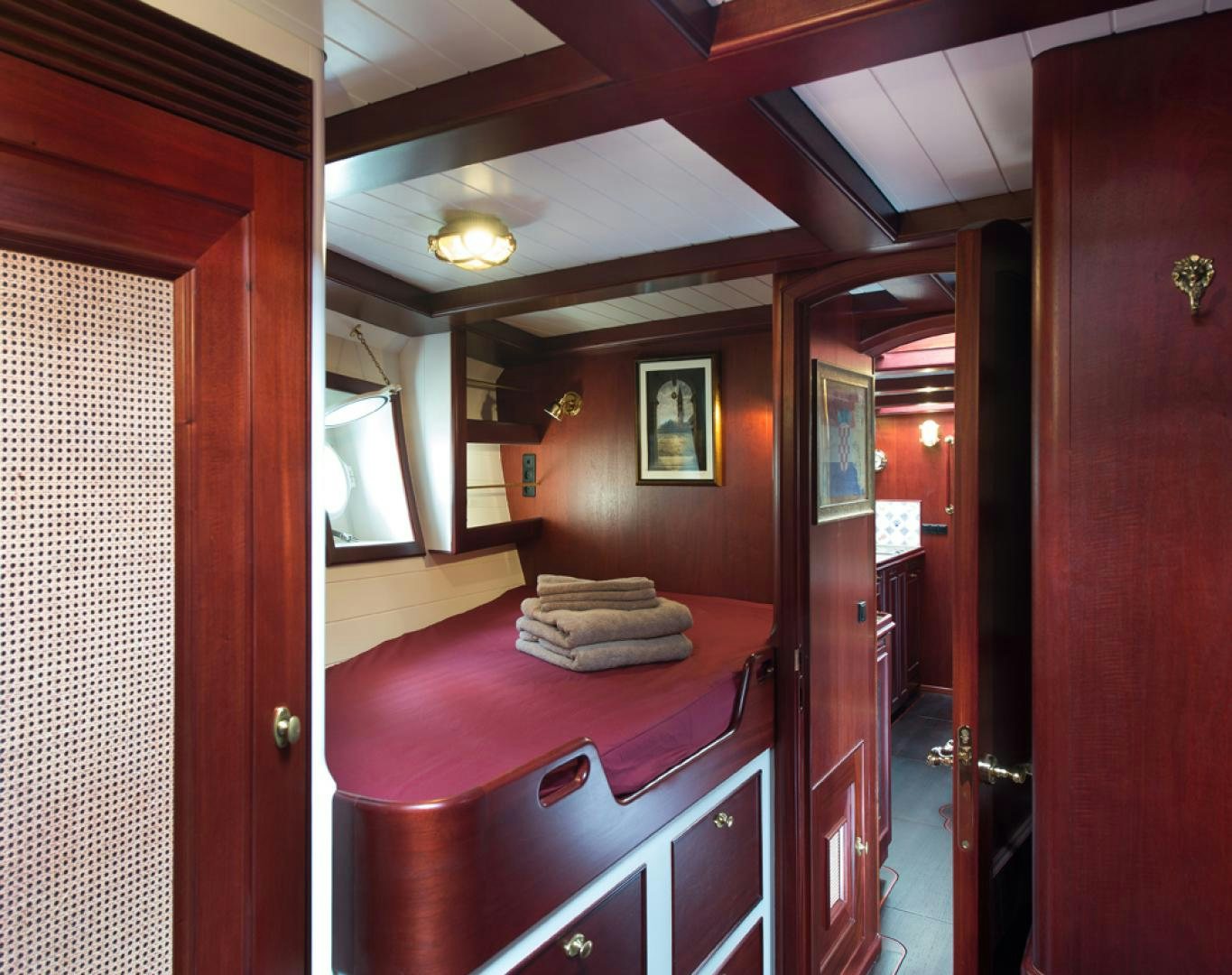 a bathroom with a red counter and a sink aboard SPIRIT OF VENICE Yacht for Sale