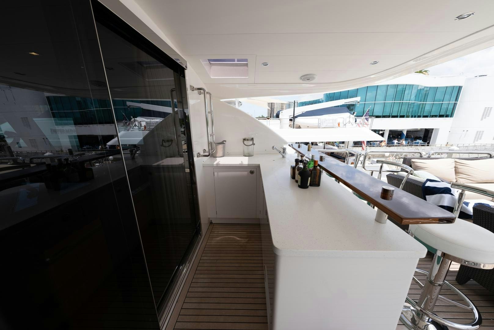 a room with a bed and desk aboard ENCORE Yacht for Sale