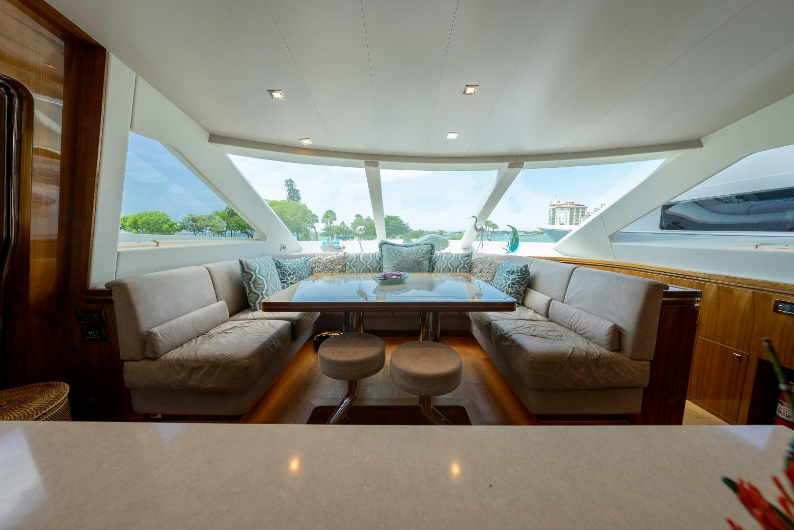 a room with a table and chairs aboard ENCORE Yacht for Sale
