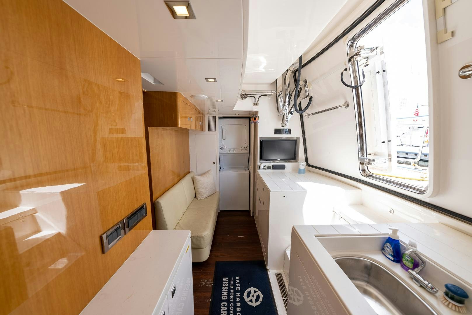 a bathroom with a sink and a microwave aboard ENCORE Yacht for Sale