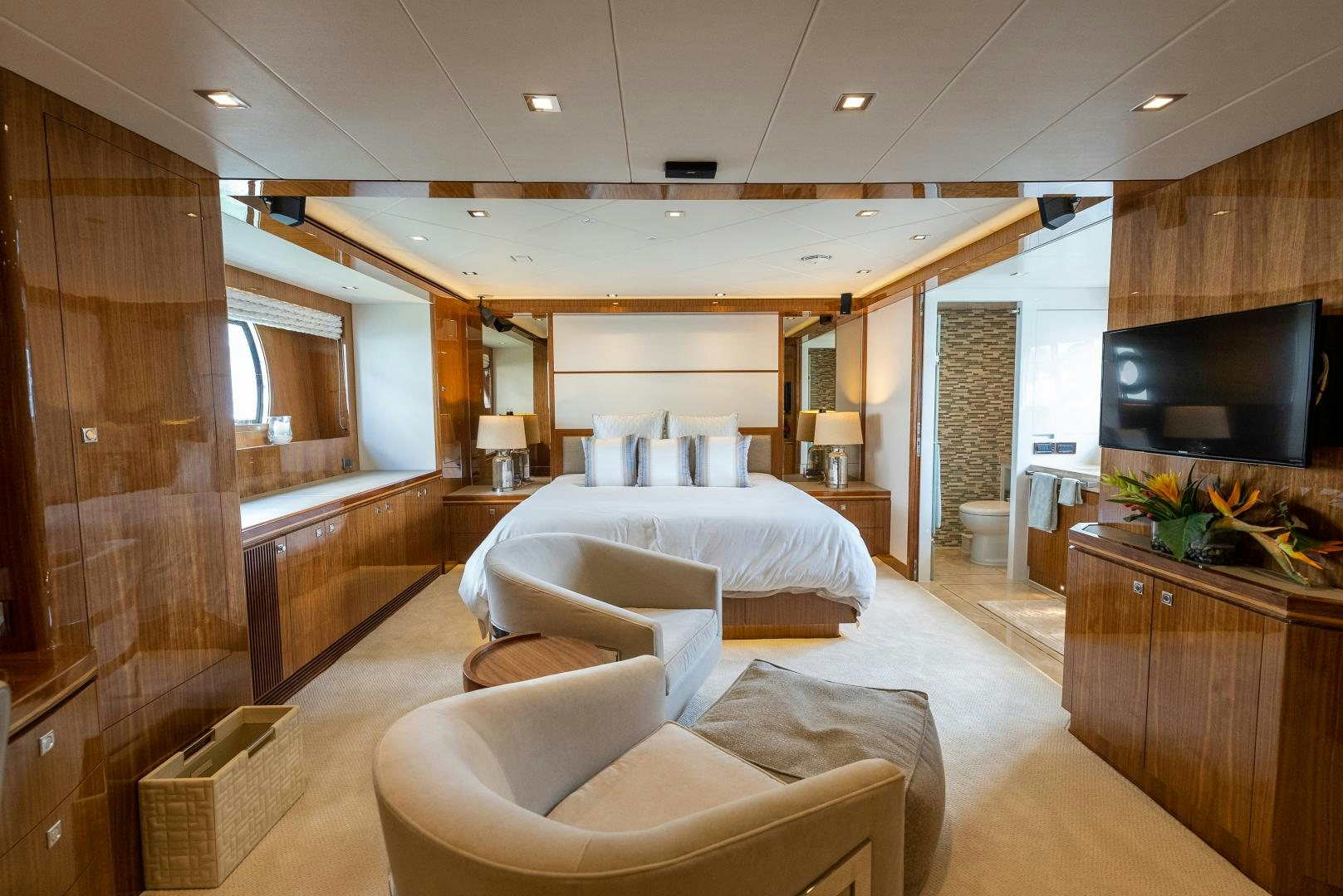 a room with a bed and a tv aboard ENCORE Yacht for Sale