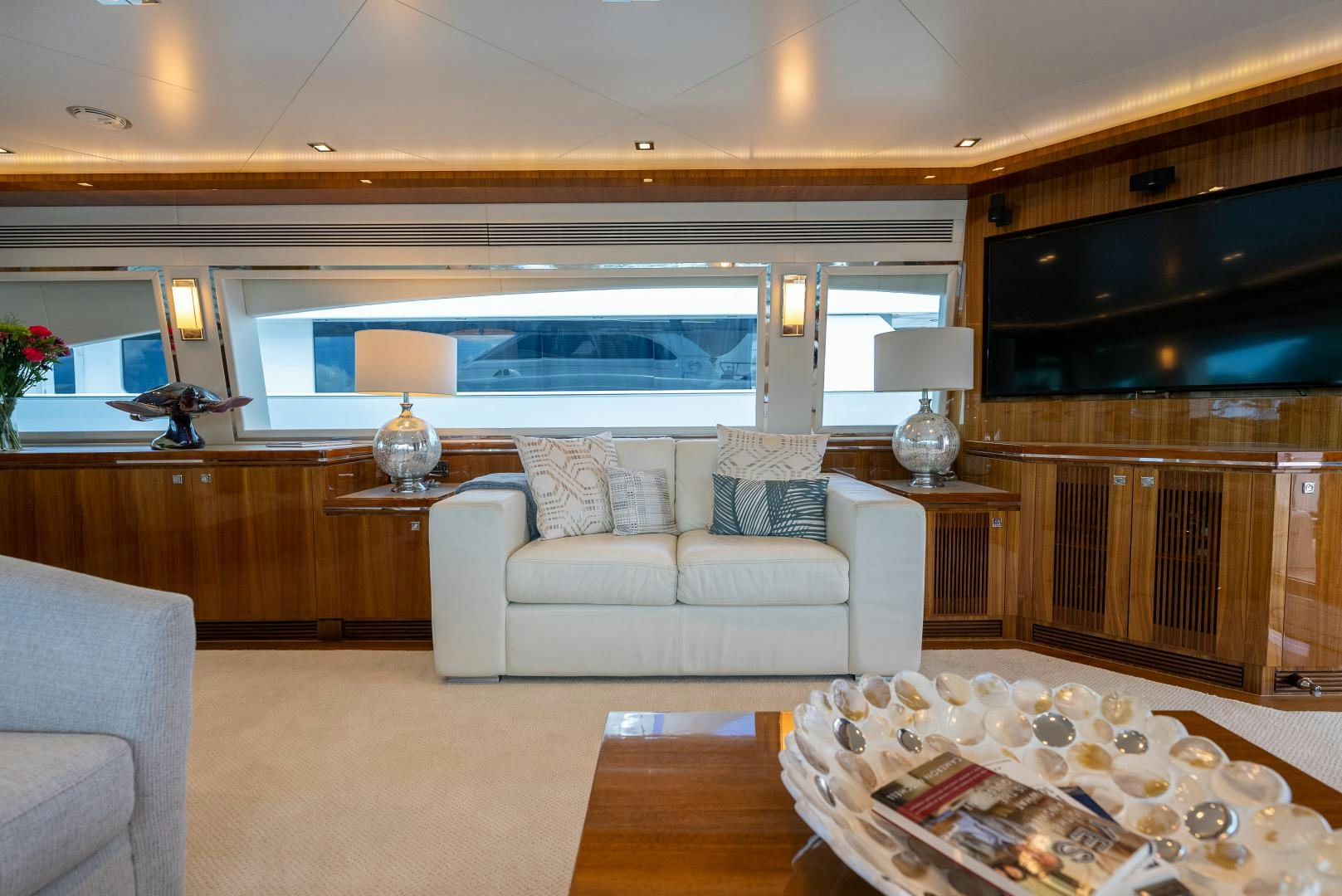 a living room with a large window aboard ENCORE Yacht for Sale