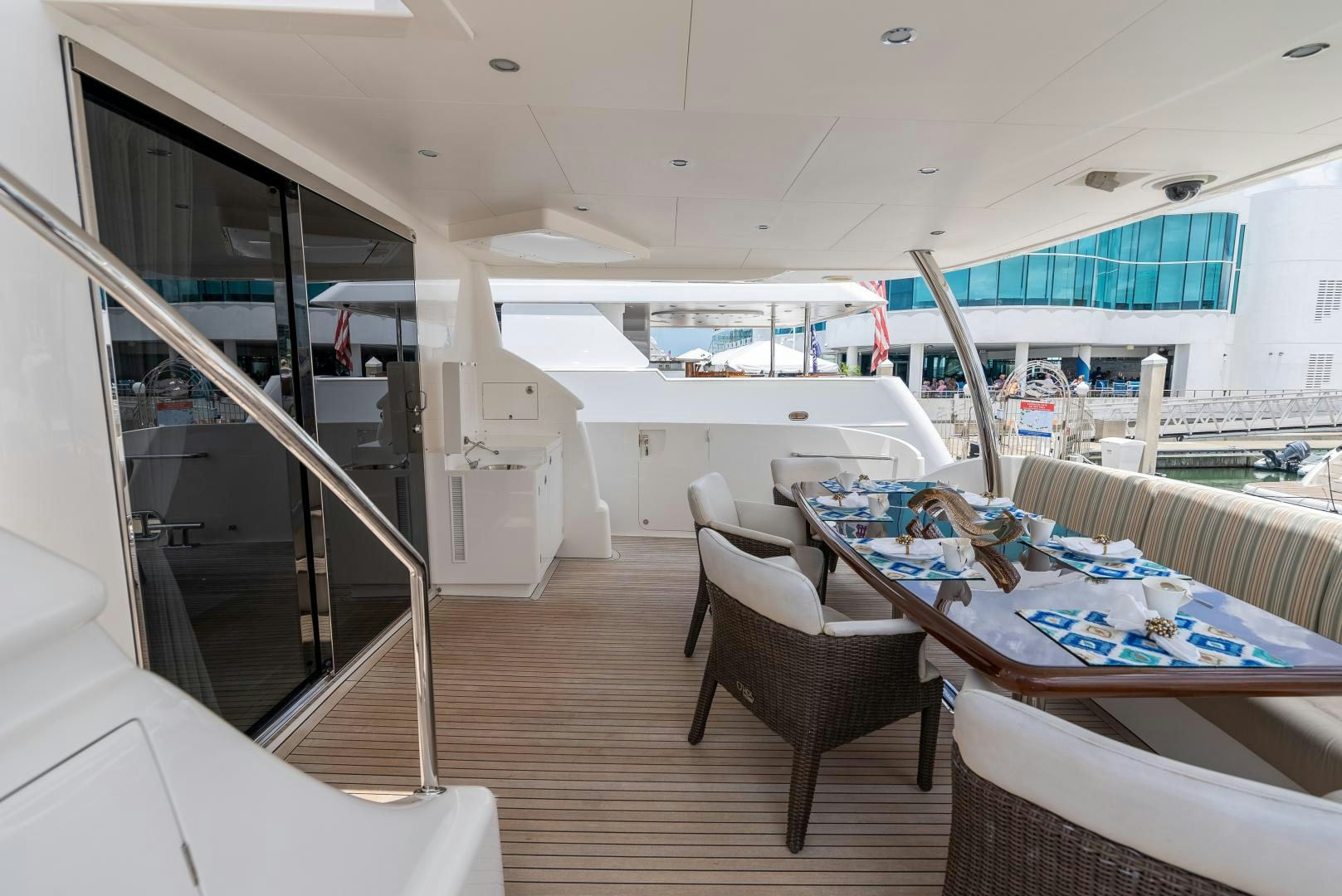 a room with a table chairs and a bed aboard ENCORE Yacht for Sale