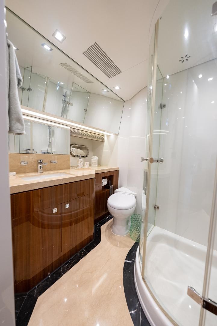 a bathroom with a stand up shower aboard ENCORE Yacht for Sale