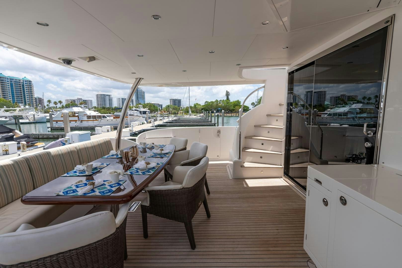a room with a table and chairs aboard ENCORE Yacht for Sale