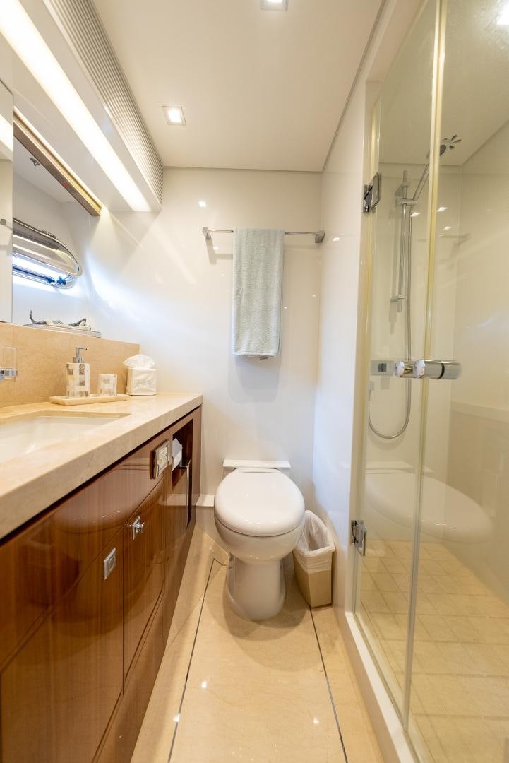 a bathroom with a standup shower aboard ENCORE Yacht for Sale