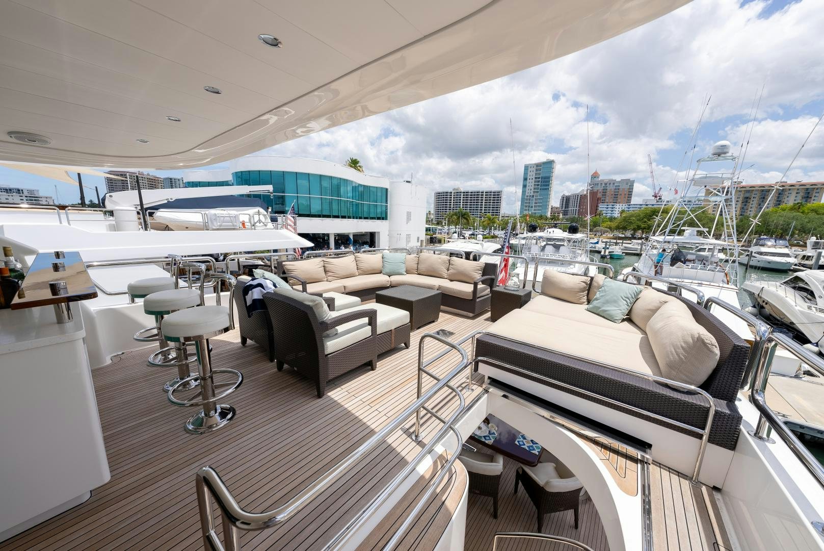 a large living room with a large balcony aboard ENCORE Yacht for Sale