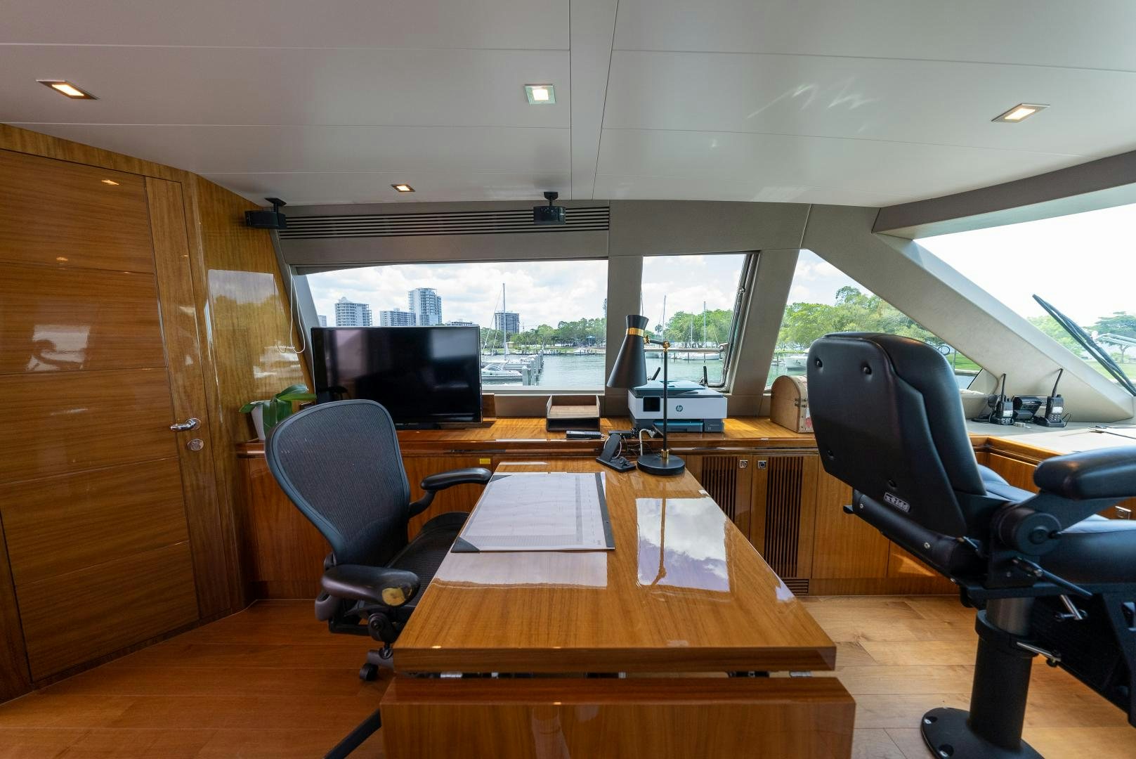 a room with a table and chairs aboard ENCORE Yacht for Sale
