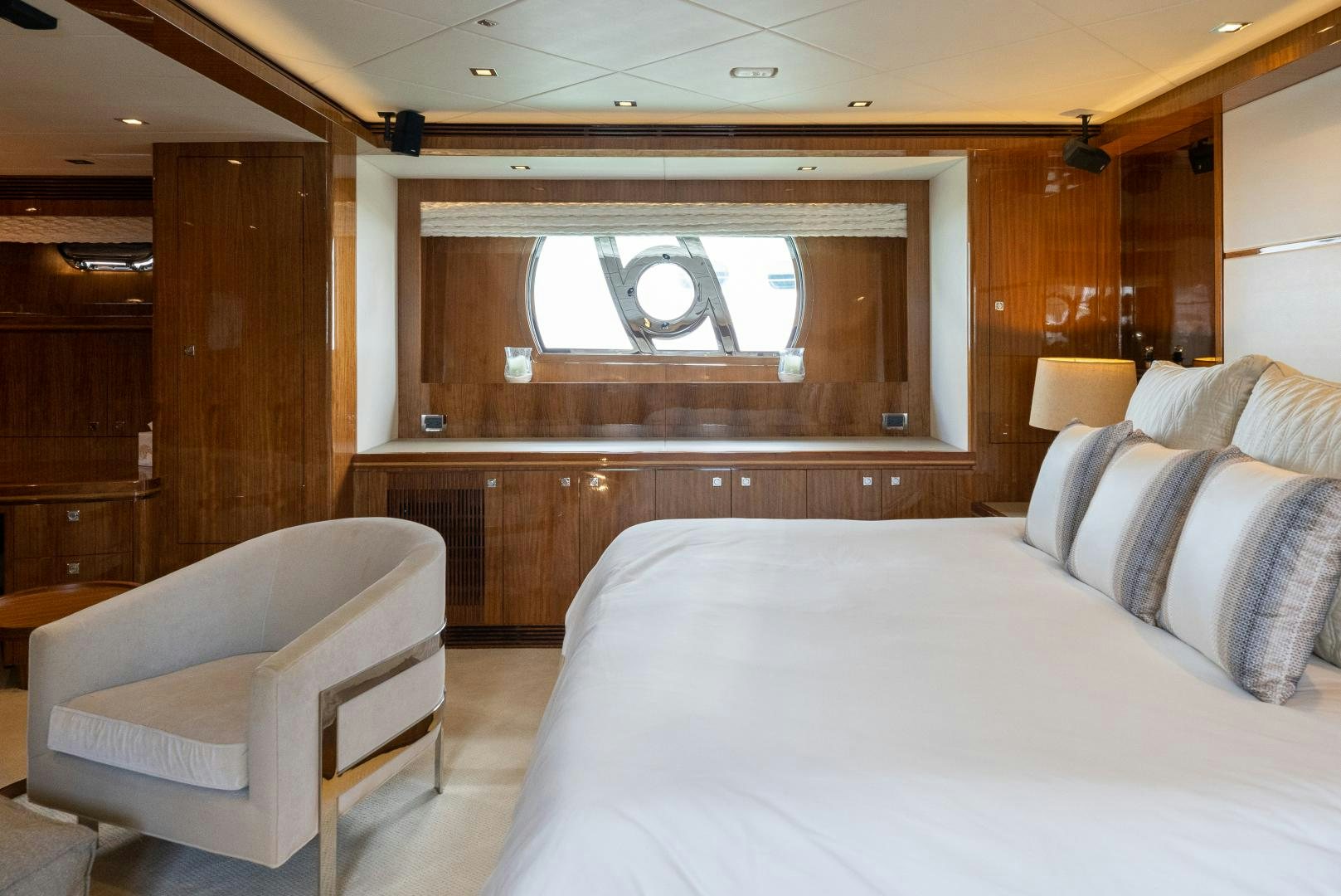 a room with a bed and a chair aboard ENCORE Yacht for Sale