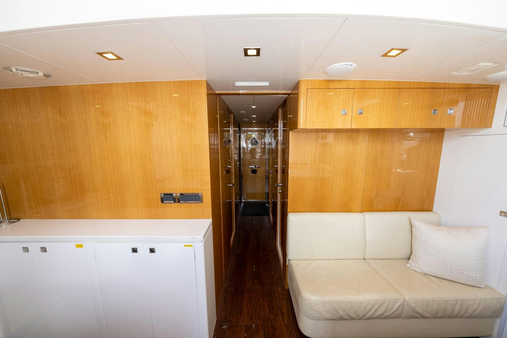 a room with a couch and a wood wall aboard ENCORE Yacht for Sale