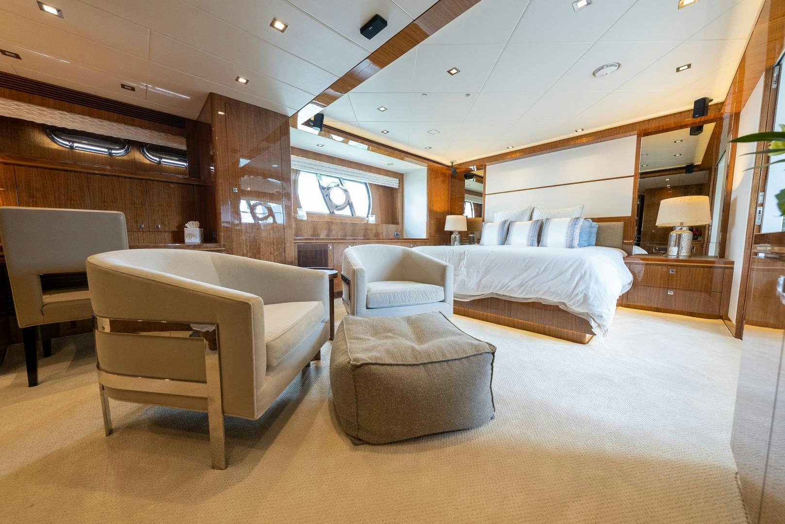 a room with a bed and a chair aboard ENCORE Yacht for Sale