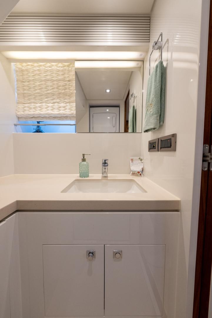 a bathroom with a sink and a mirror aboard ENCORE Yacht for Sale