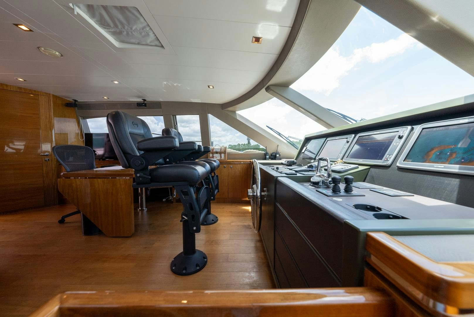 a room with a desk and a chair aboard ENCORE Yacht for Sale