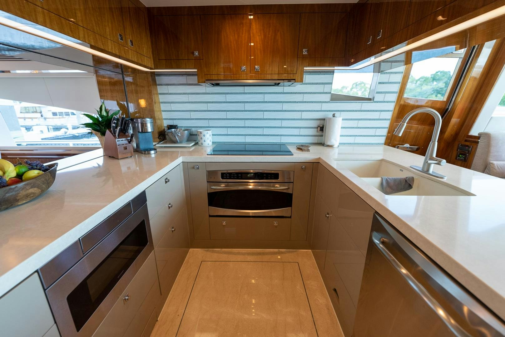a kitchen with wooden cabinets aboard ENCORE Yacht for Sale
