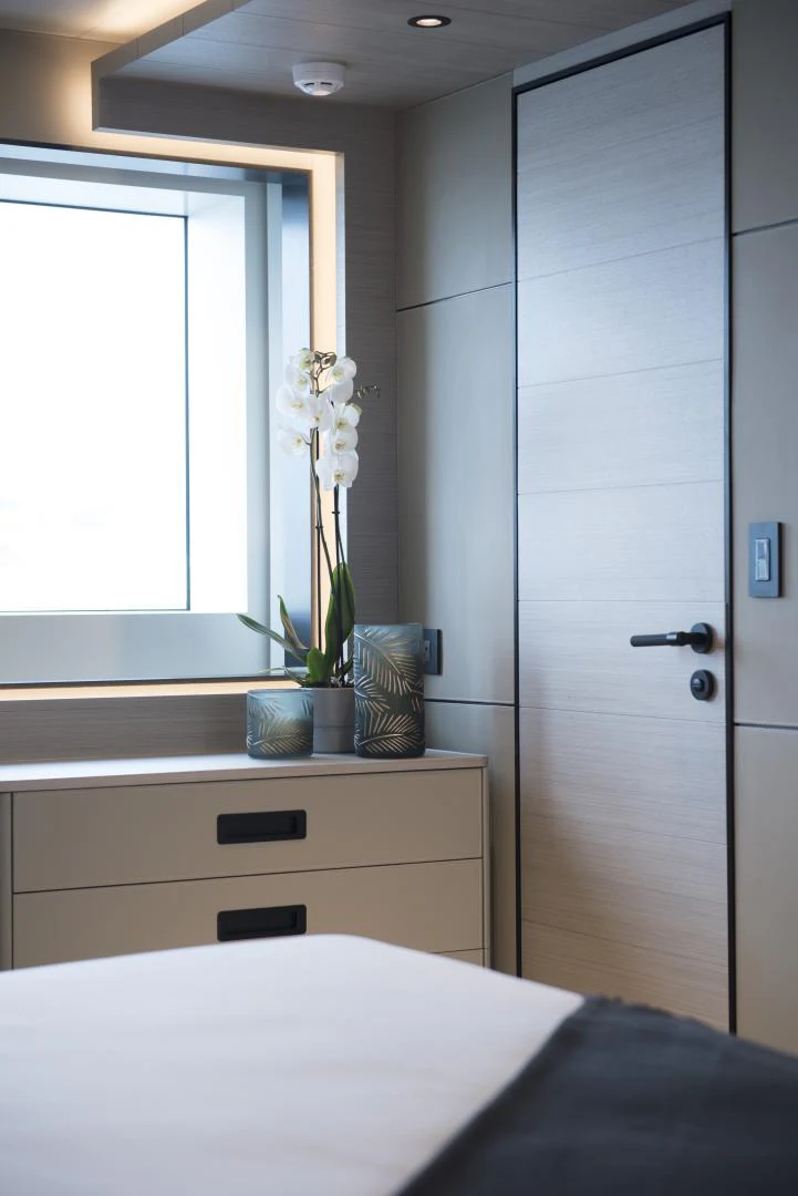 a room with a closet and a bed aboard ALFRESCO 125 Yacht for Sale