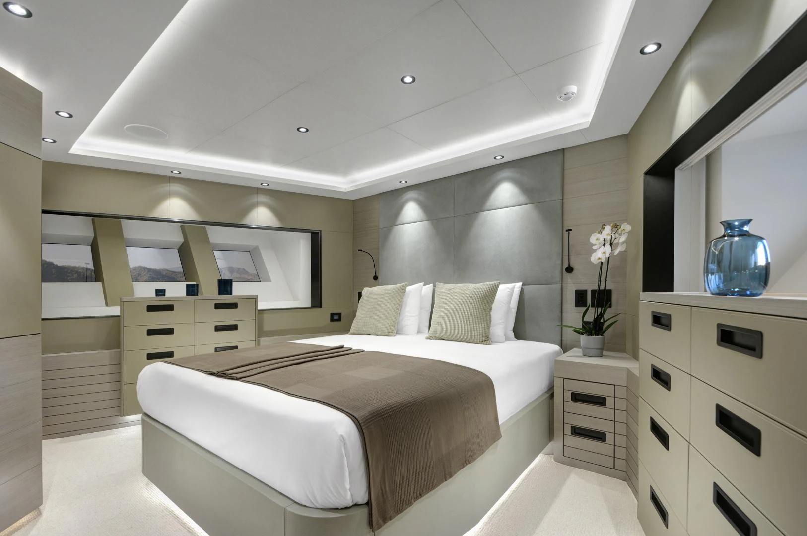 a room with a bed and cabinets aboard ALFRESCO 125 Yacht for Sale