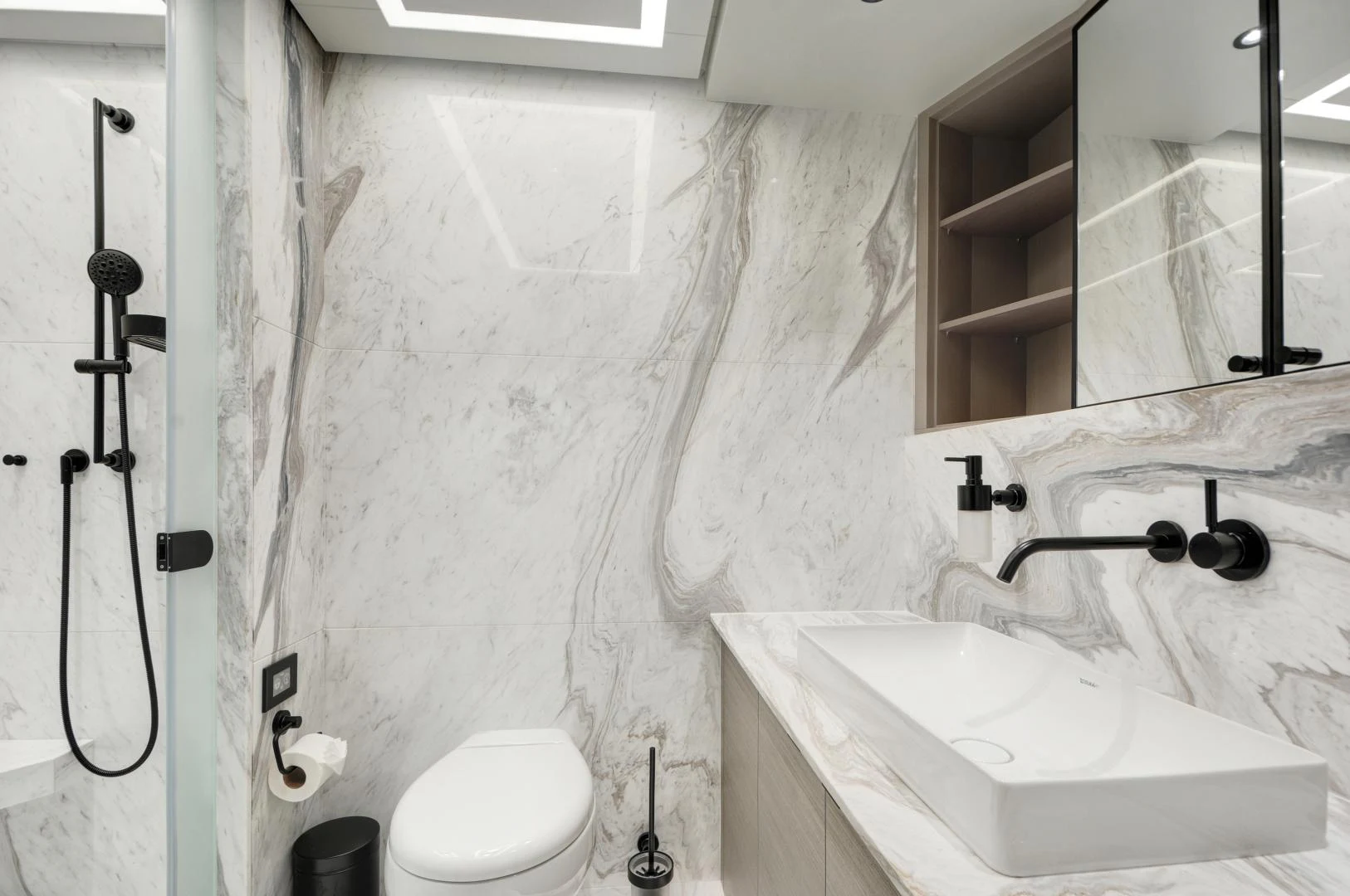 a bathroom with a sink and toilet aboard ALFRESCO 125 Yacht for Sale