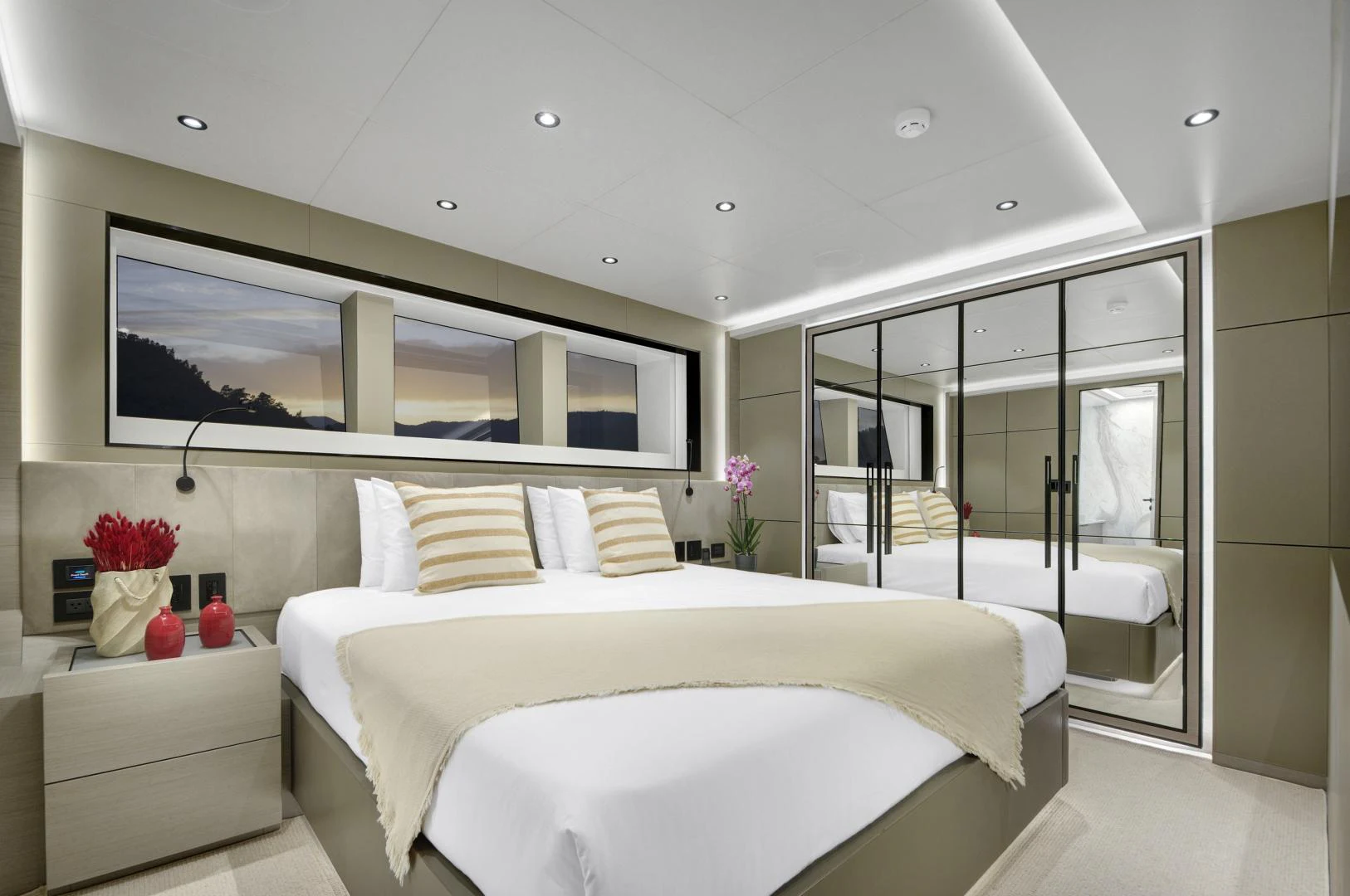 a modern bedroom with a glass door aboard ALFRESCO 125 Yacht for Sale