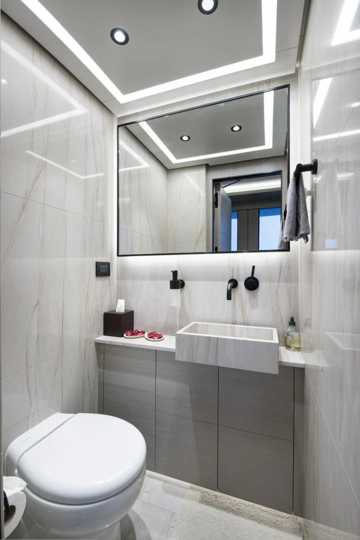 a bathroom with a toilet and a sink aboard ALFRESCO 125 Yacht for Sale