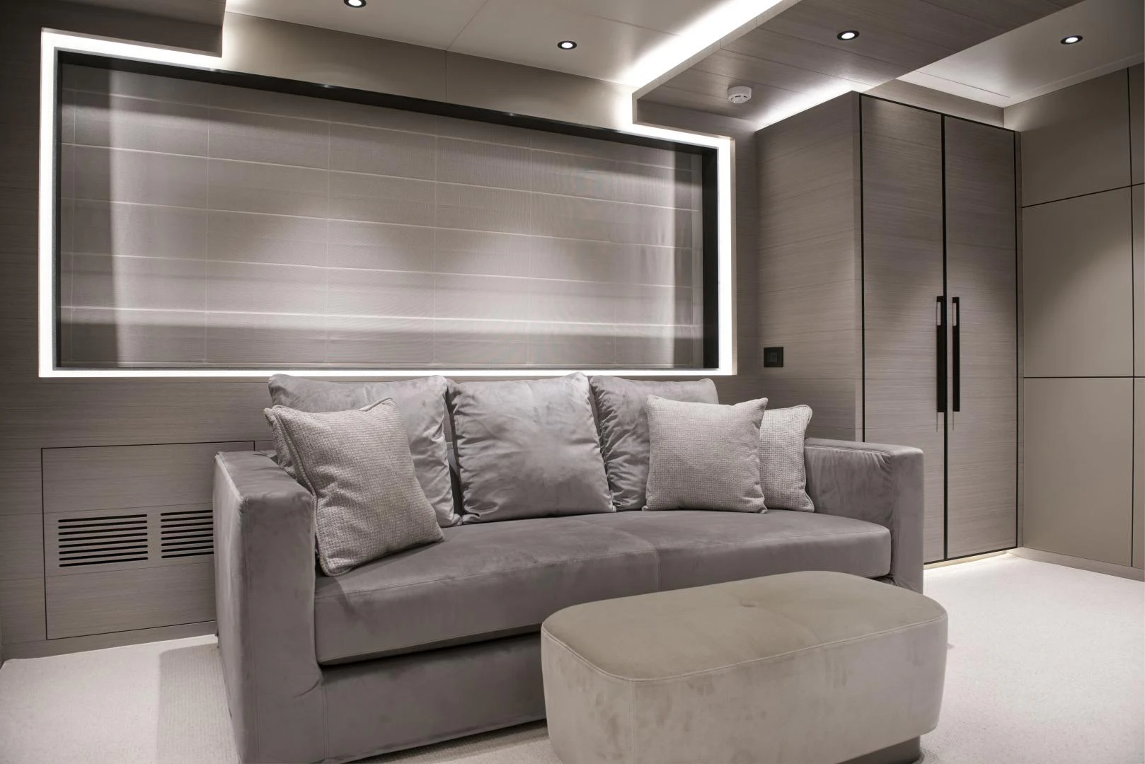 a couch in a room aboard ALFRESCO 125 Yacht for Sale