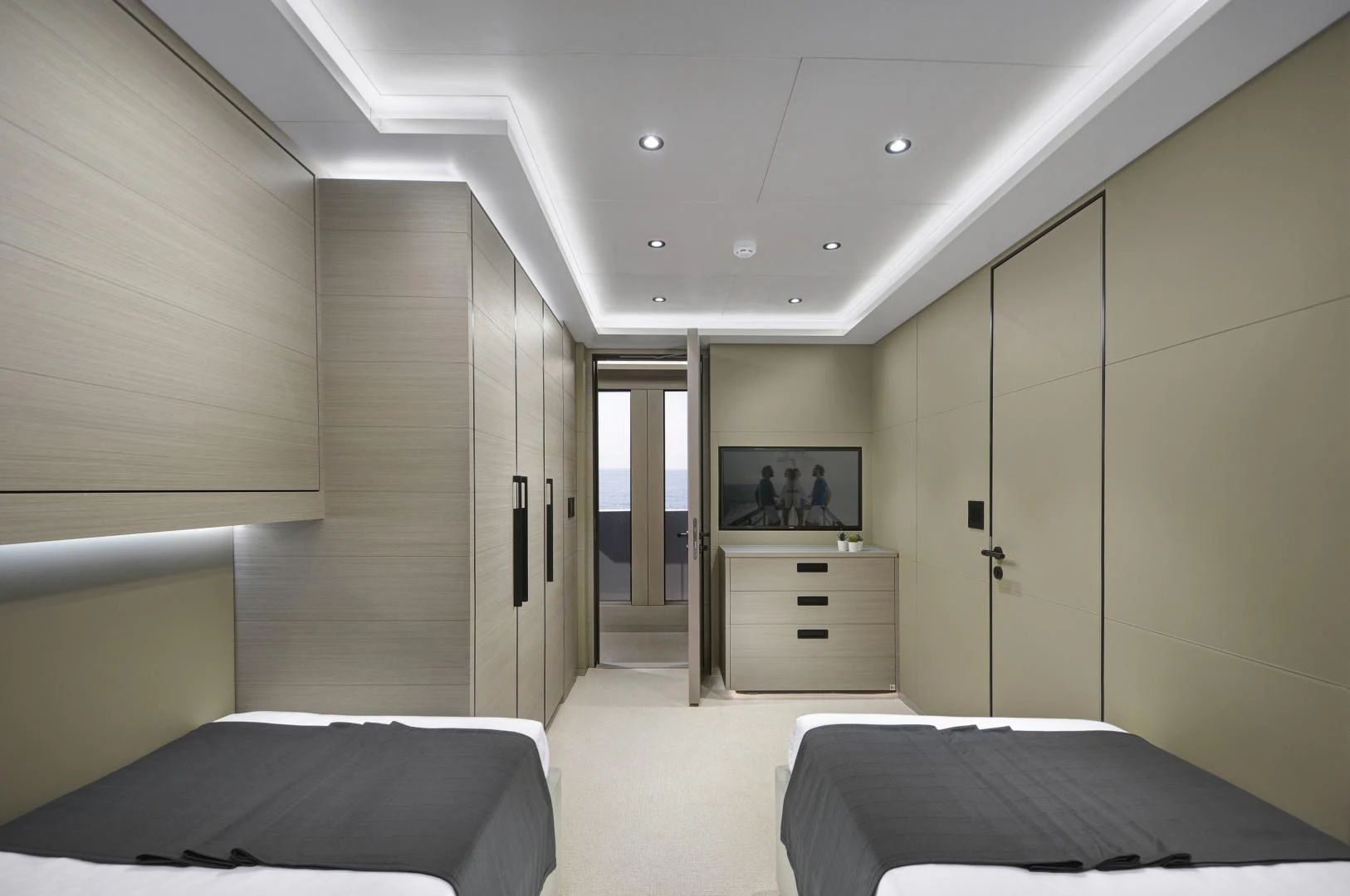 a bedroom with a bed and a tv on the wall aboard ALFRESCO 125 Yacht for Sale