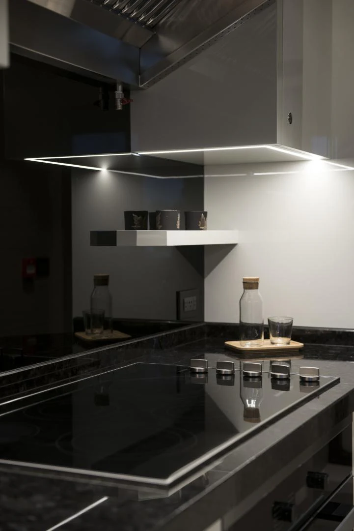 a kitchen with a glass counter aboard ALFRESCO 125 Yacht for Sale