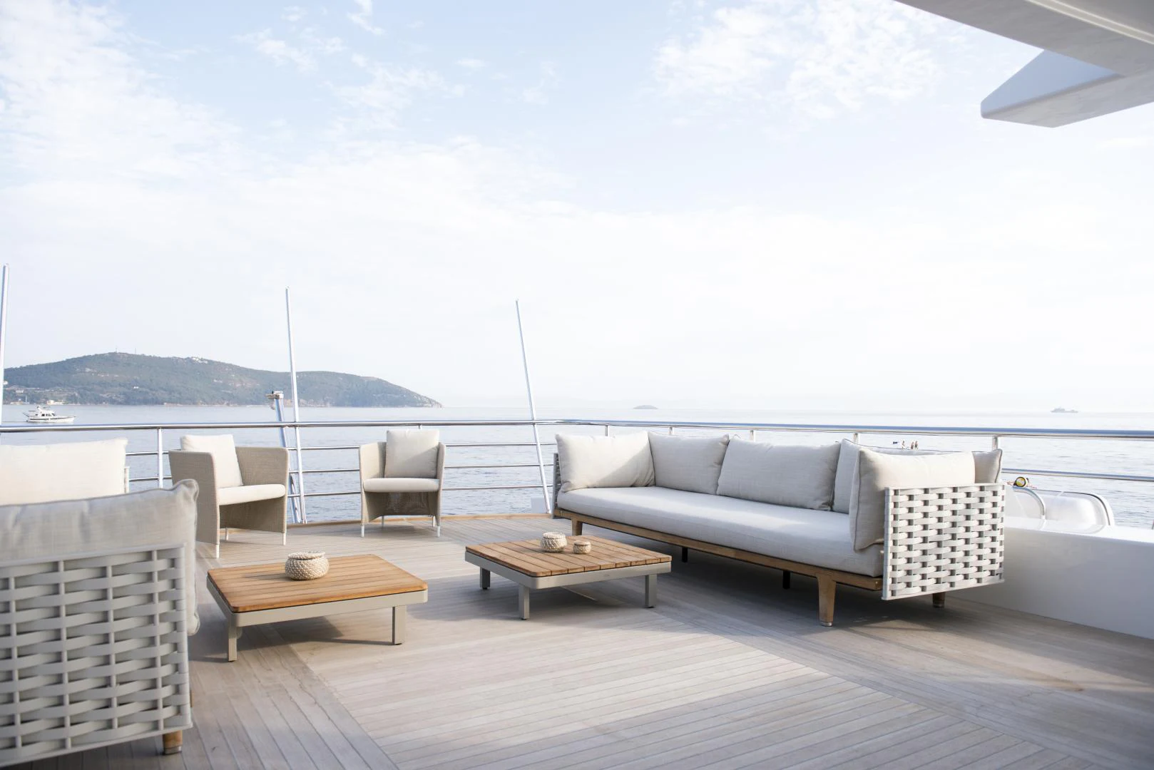 a deck with chairs and a table on it aboard ALFRESCO 125 Yacht for Sale