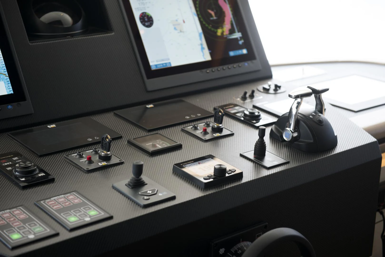 a desk with a computer monitor and phones on it aboard ALFRESCO 125 Yacht for Sale