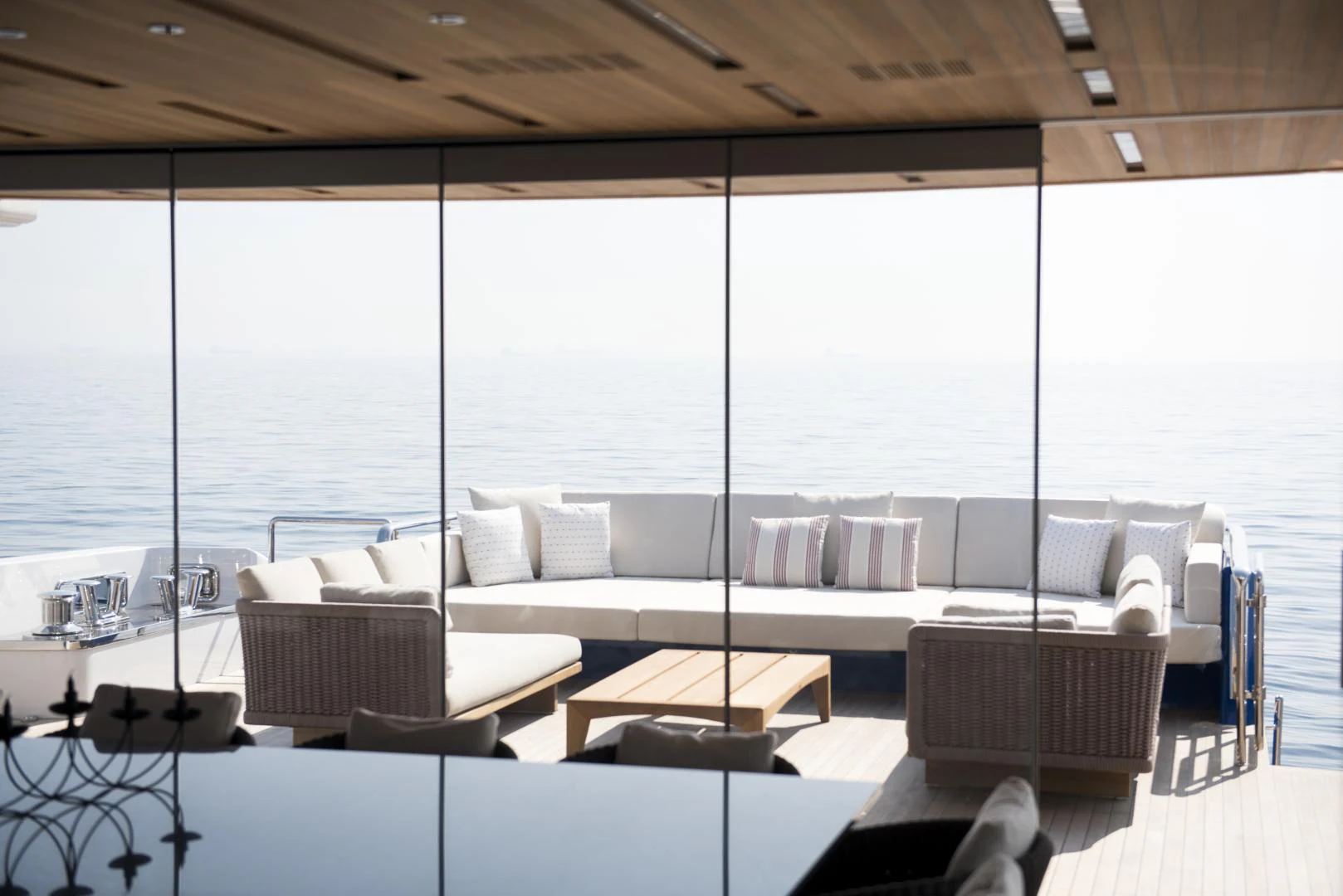 a room with a couch and a table and a large window aboard ALFRESCO 125 Yacht for Sale