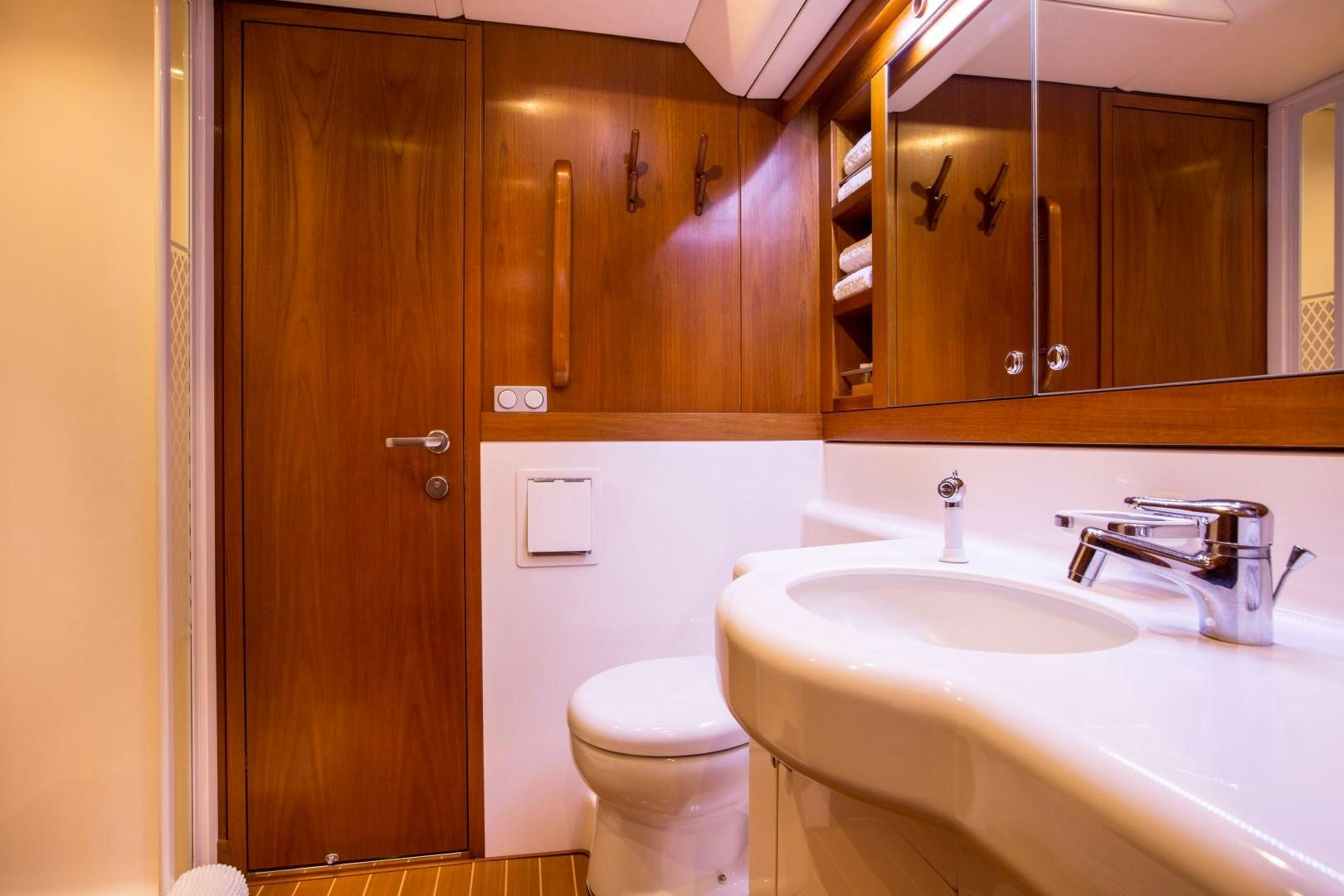 a bathroom with a sink and toilet aboard UMIKO Yacht for Sale
