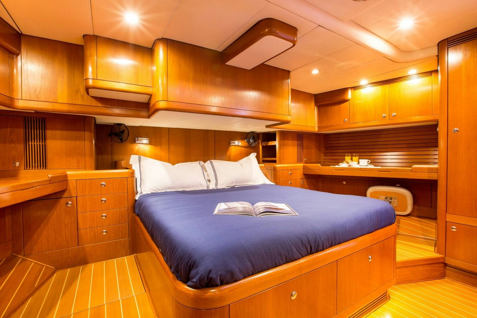 a large bed in a room aboard UMIKO Yacht for Sale