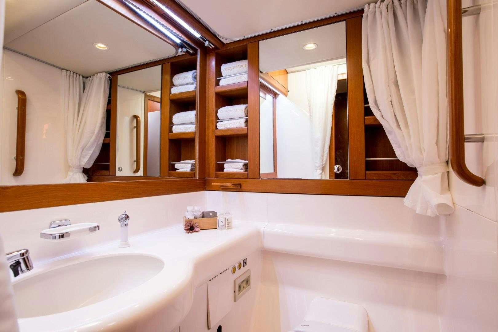 a bathroom with a large mirror aboard UMIKO Yacht for Sale