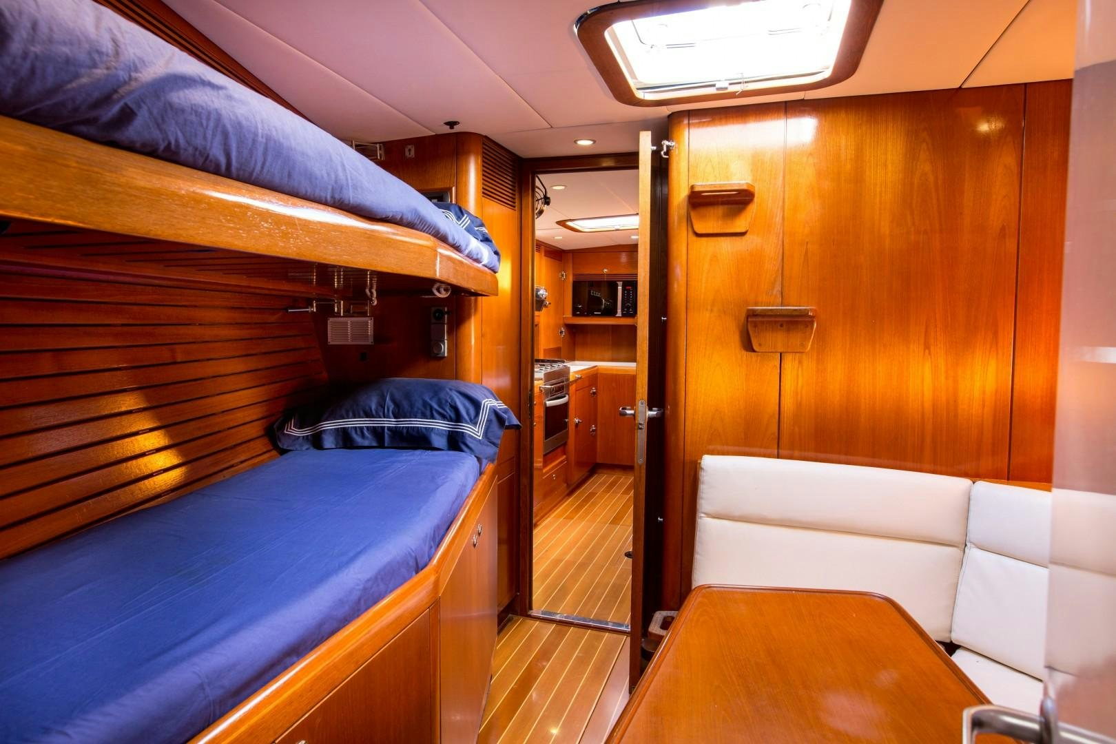 a room with bunk beds aboard UMIKO Yacht for Sale