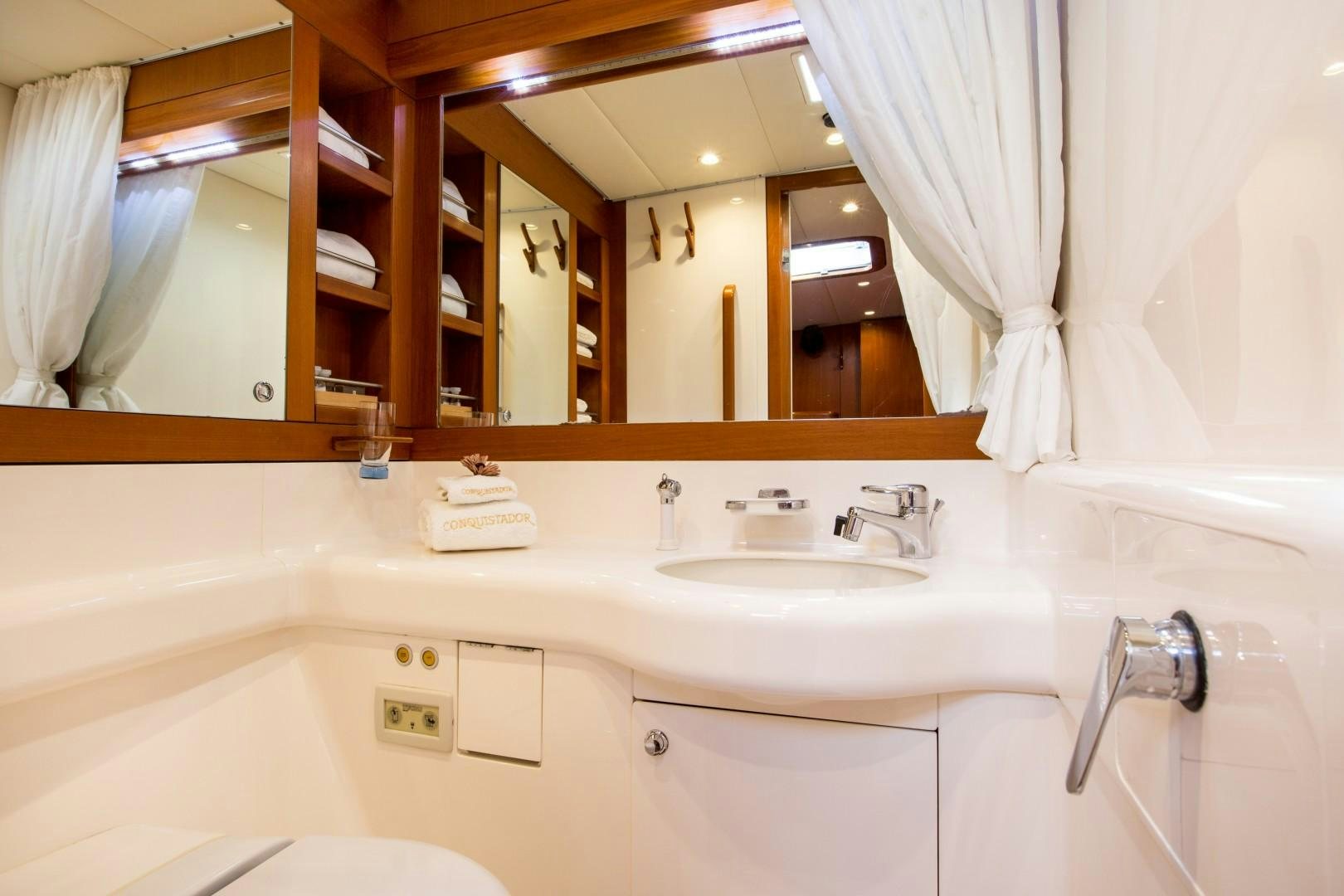 a bathroom with a large mirror aboard UMIKO Yacht for Sale
