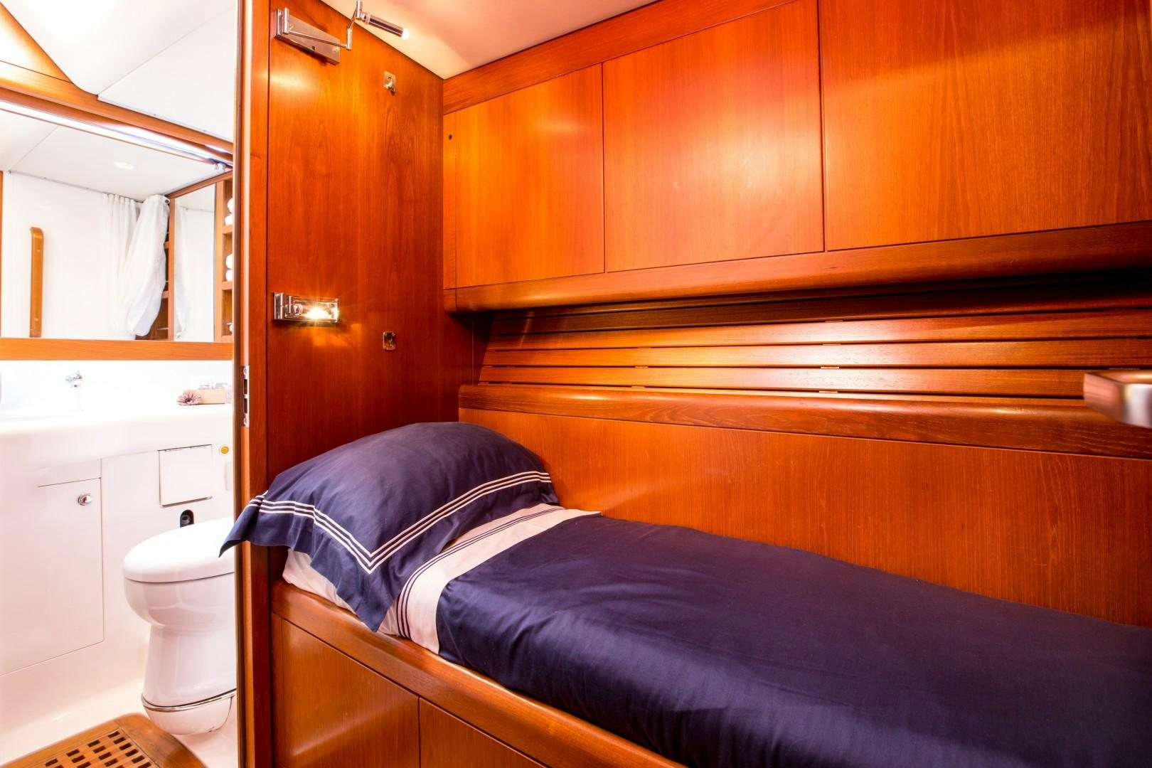 a bed in a room aboard UMIKO Yacht for Sale
