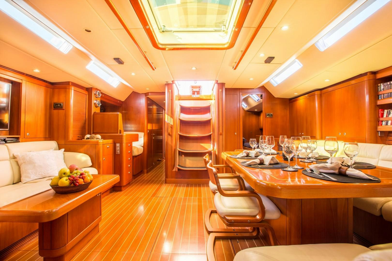 a kitchen with a table and chairs aboard UMIKO Yacht for Sale