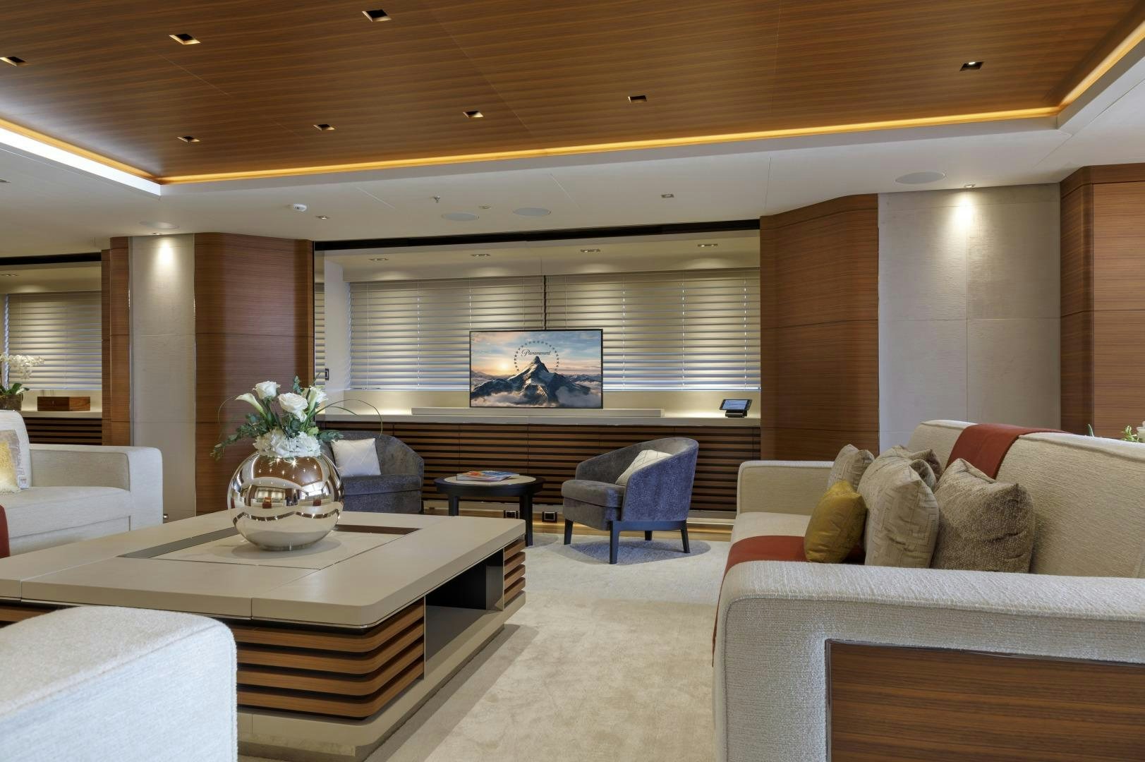 a room with a couch and a table aboard ATOMIC Yacht for Sale