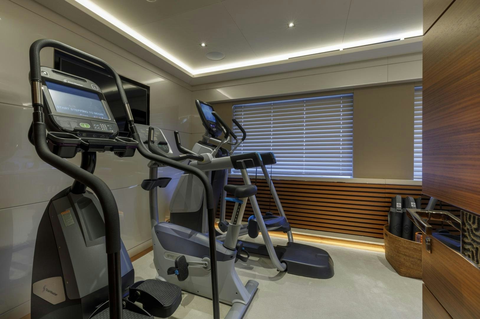 a gym with exercise equipment aboard ATOMIC Yacht for Sale