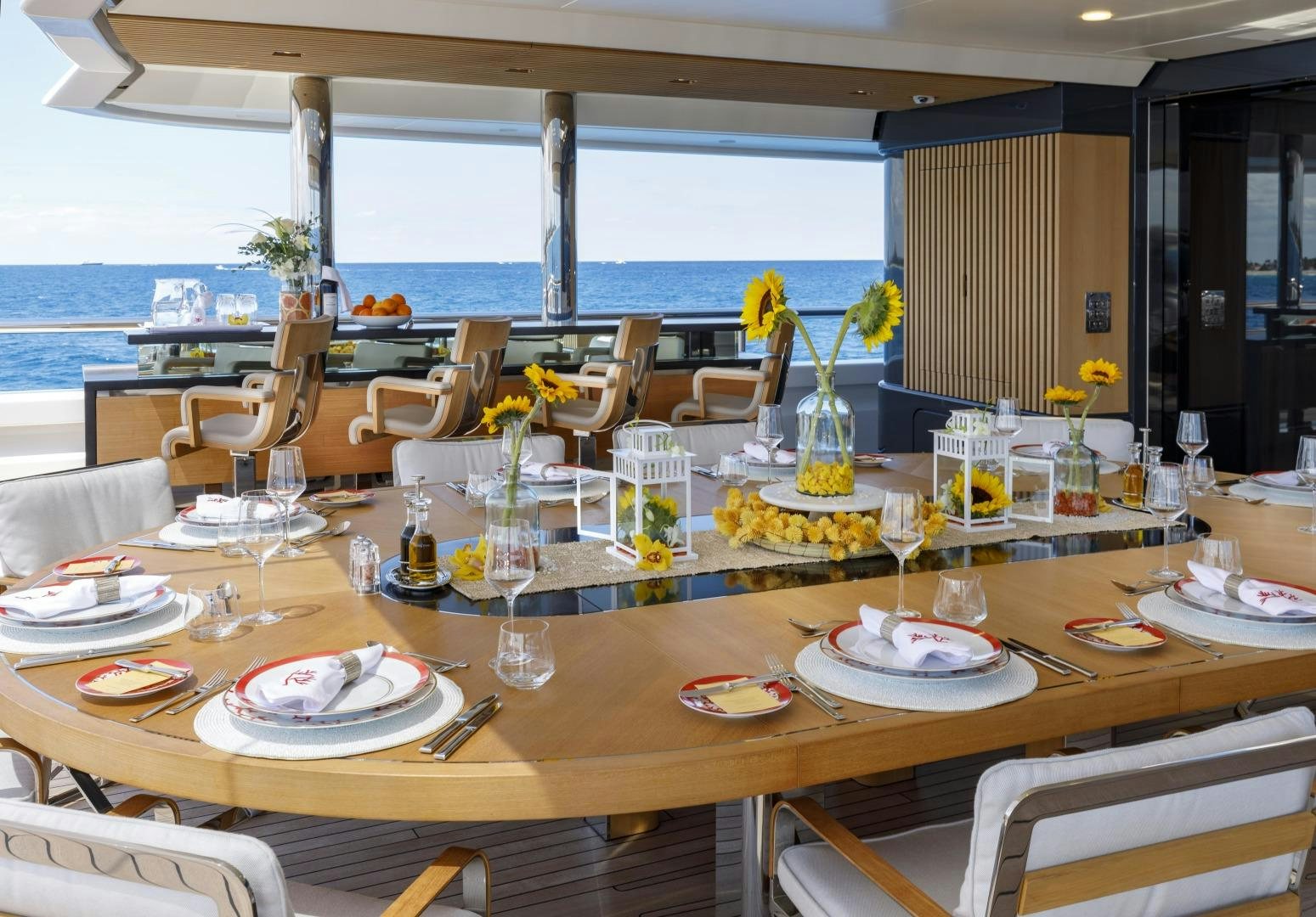 a table set for a dinner party aboard ATOMIC Yacht for Sale