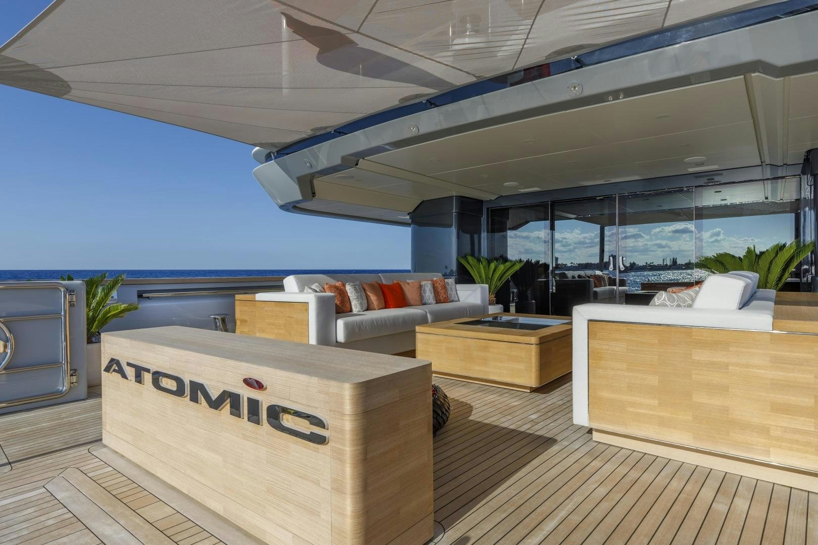 a room with a couch and a table aboard ATOMIC Yacht for Sale