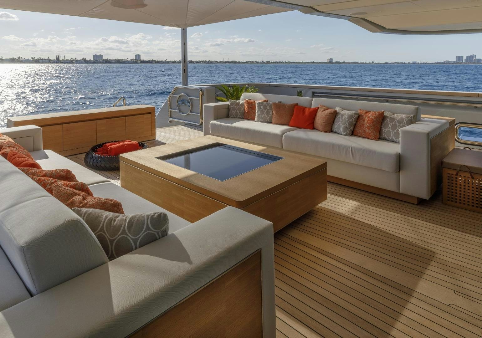 a living room with a couch and a table aboard ATOMIC Yacht for Sale