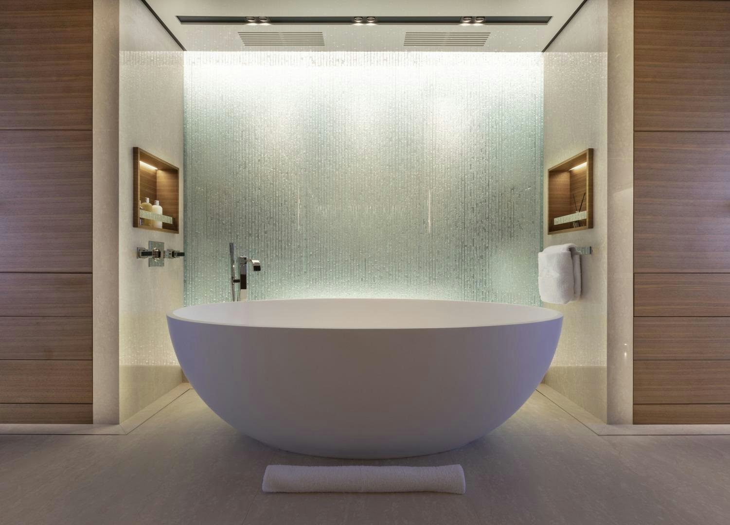 a bathroom with a tub aboard ATOMIC Yacht for Sale