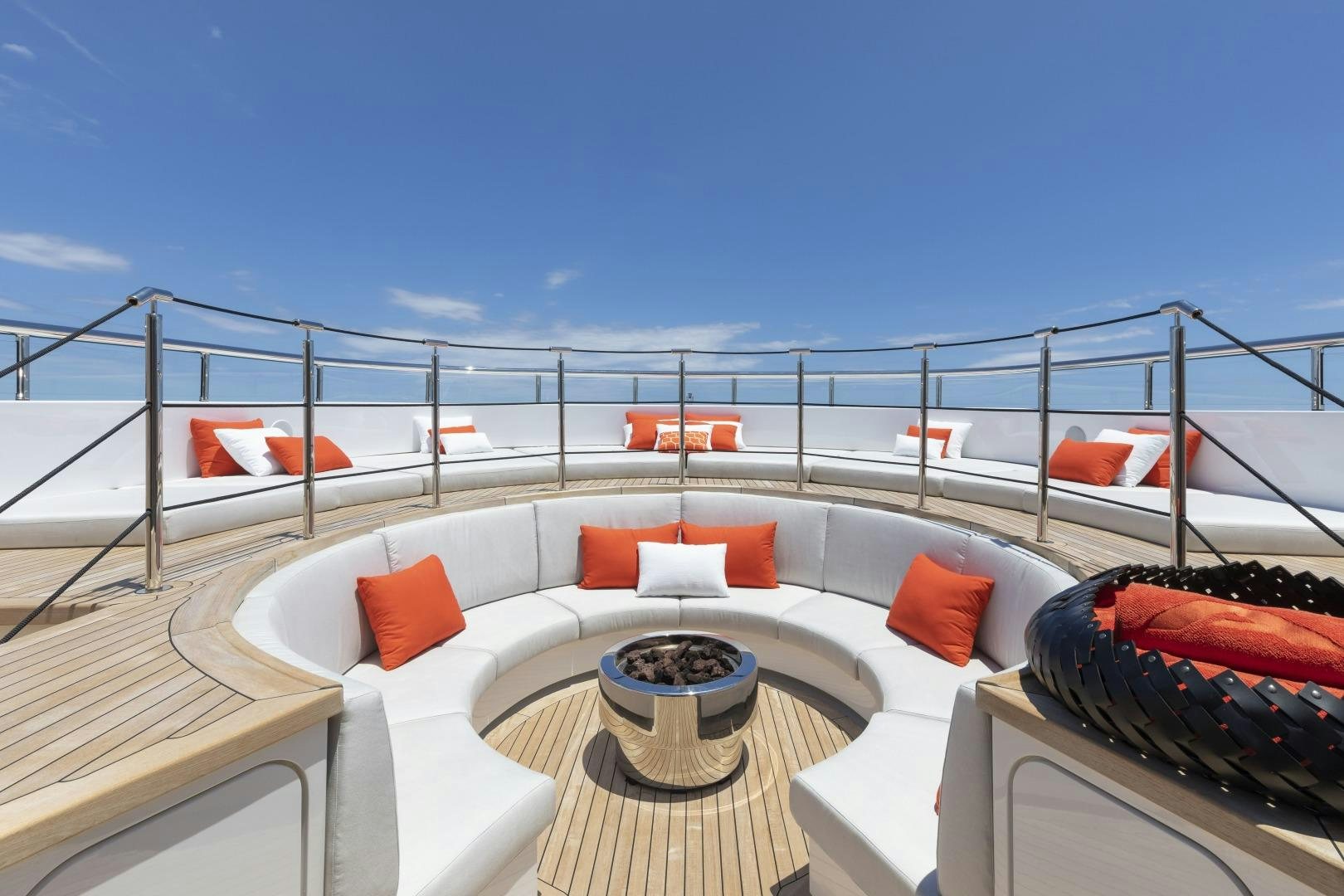 a balcony with a view of the ocean and beach aboard ATOMIC Yacht for Sale