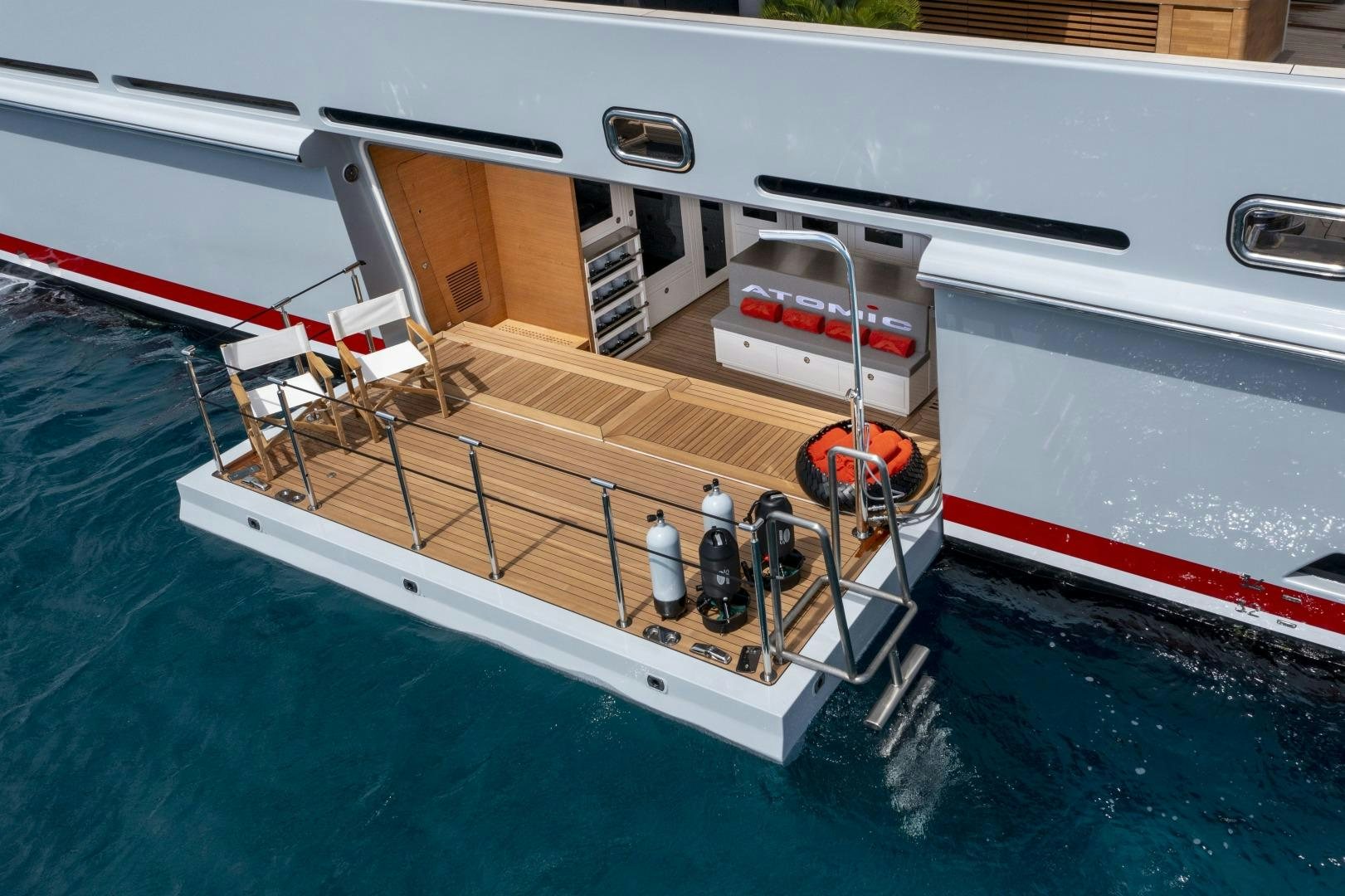 a boat with a deck and a deck aboard ATOMIC Yacht for Sale