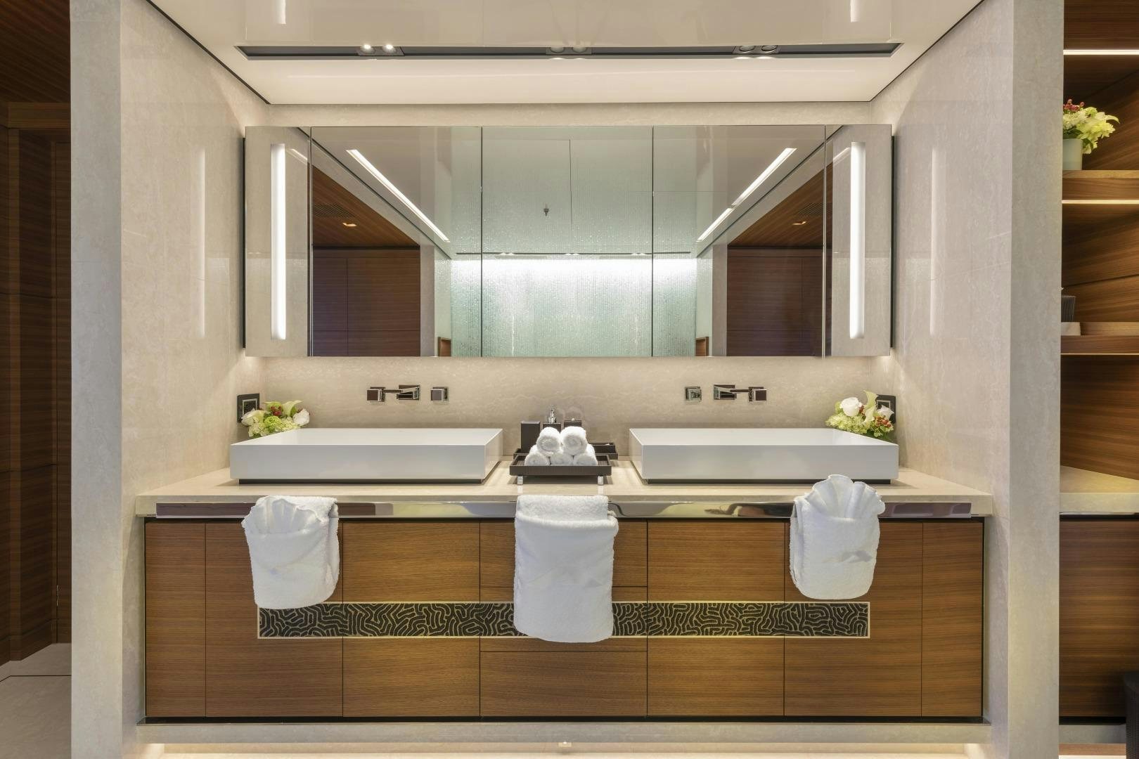 a bathroom with a large mirror aboard ATOMIC Yacht for Sale