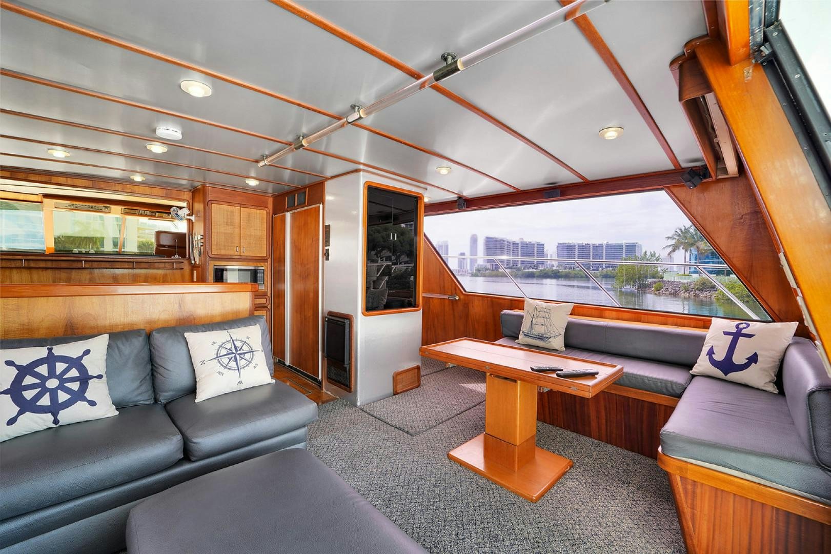 a living room with a large window aboard STEALIN TIME Yacht for Sale