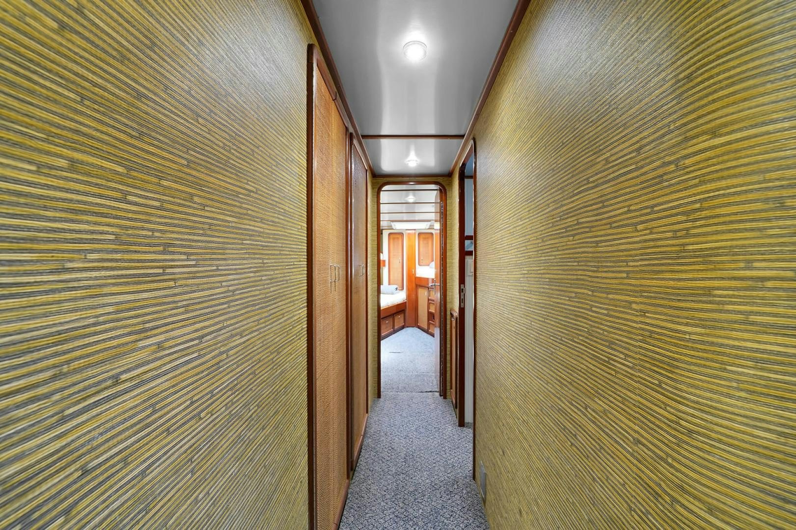 a hallway with wood doors aboard STEALIN TIME Yacht for Sale