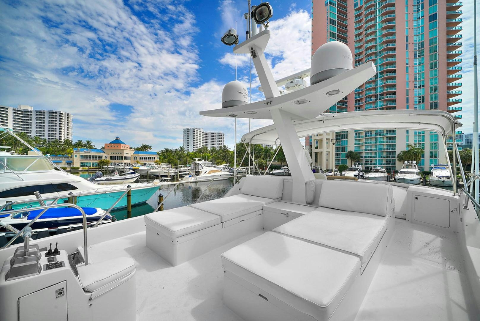 a white boat in a harbor aboard STEALIN TIME Yacht for Sale
