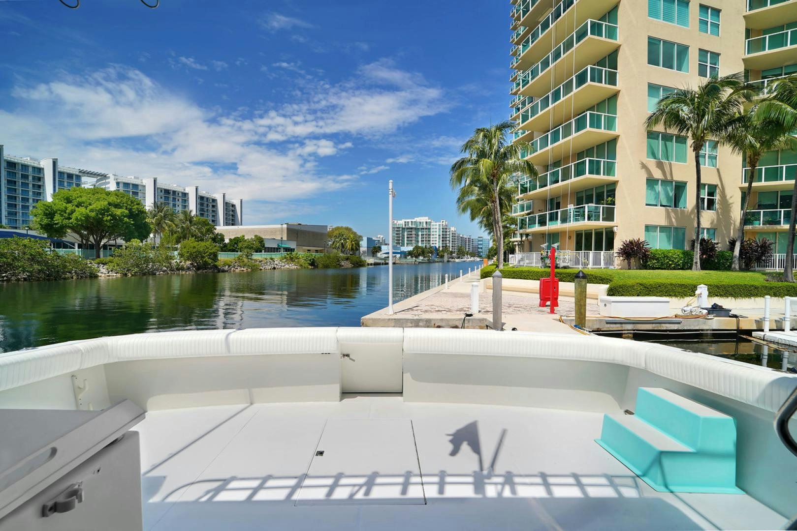 a pool with a building in the background aboard STEALIN TIME Yacht for Sale