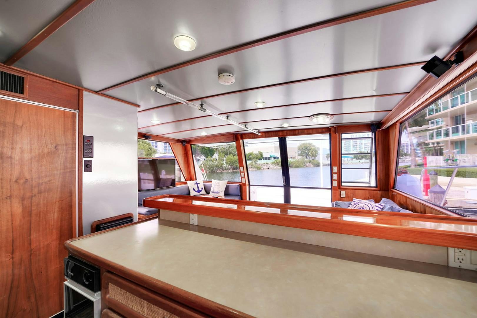 a room with a table and chairs aboard STEALIN TIME Yacht for Sale